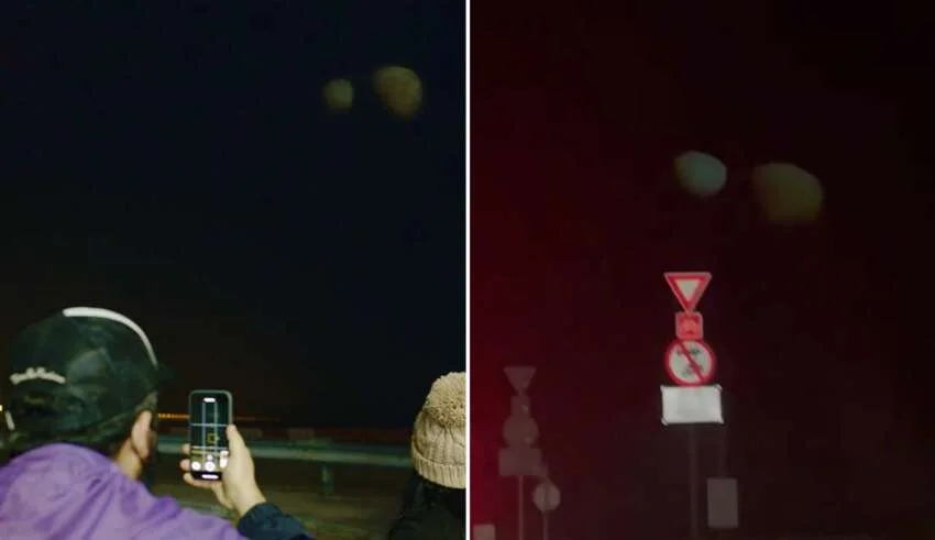 Dois estranhos e enormes objetos aparecem no céu noturno, muito parecidos com planetas.